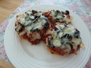 English muffin pizzas topped with olives